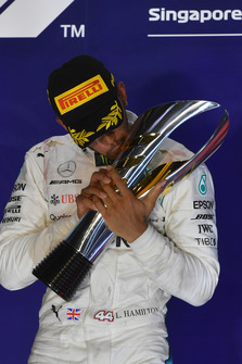 Race winner Lewis Hamilton, Mercedes AMG F1 celebrates on the podium with the trophy