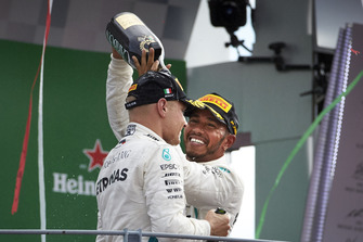 Lewis Hamilton, Mercedes AMG F1, celebrates on the podium, with Valtteri Bottas, Mercedes AMG F1