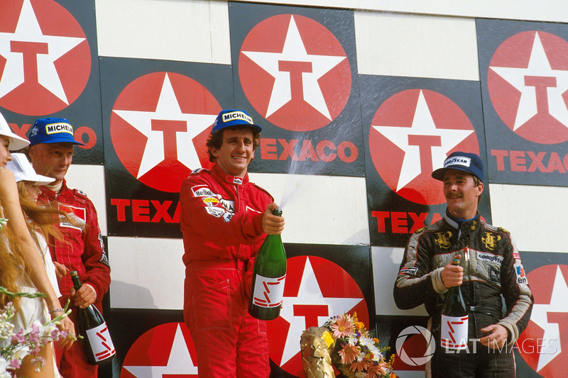 Podium: race winner Alain Prost, second place Niki Lauda, third place Nigel Mansell