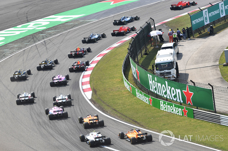 Sebastian Vettel, Ferrari SF71H and Kimi Raikkonen, Ferrari SF71H lead at the start of the race