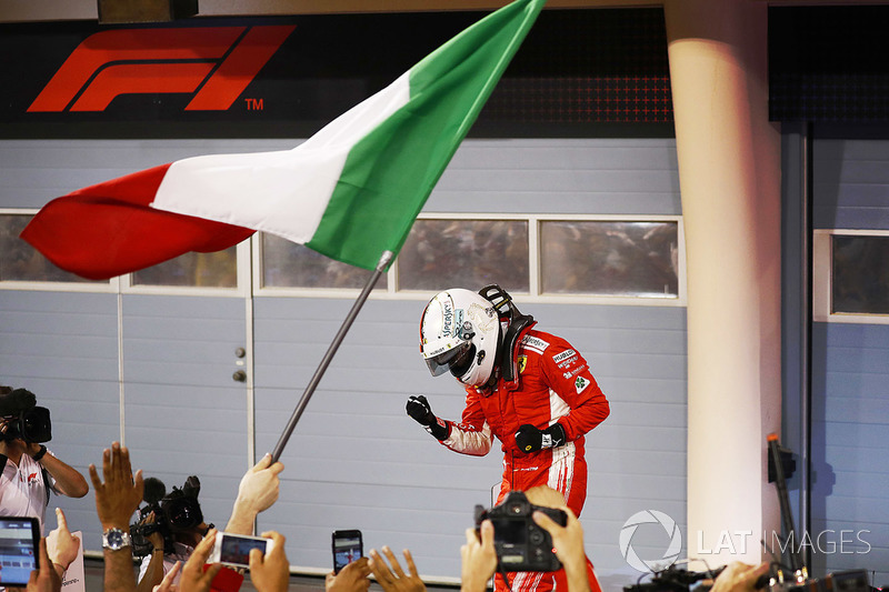 Sebastian Vettel, Ferrari, celebrates with his team after winning the race