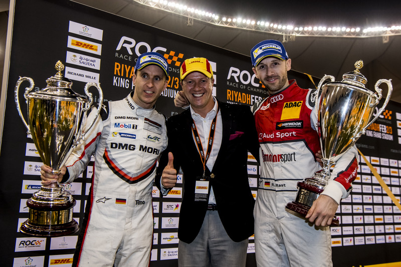 René Rast and Timo Bernhard with their winners trophies