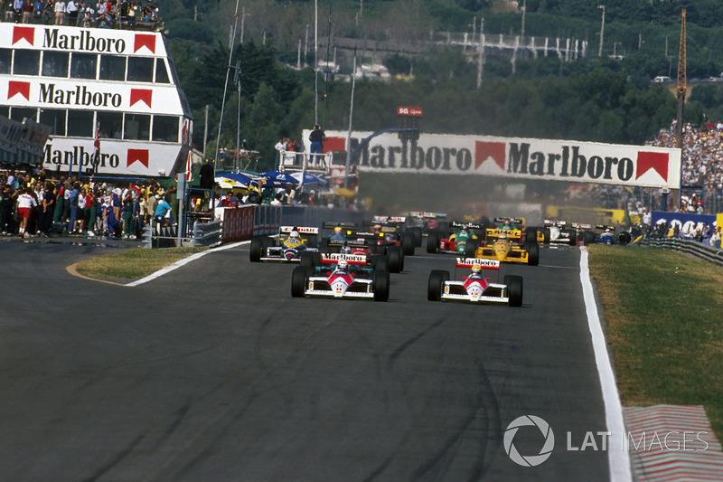 Alain Prost, McLaren MP4/4 devant Ayrton Senna, McLaren MP4/4 et Ivan Capelli, March 881 au départ