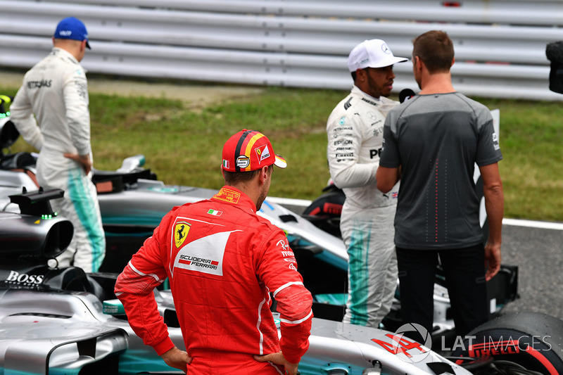 Sebastian Vettel, Ferrari, Lewis Hamilton, Mercedes AMG F1 and Jenson Button, in parc ferme