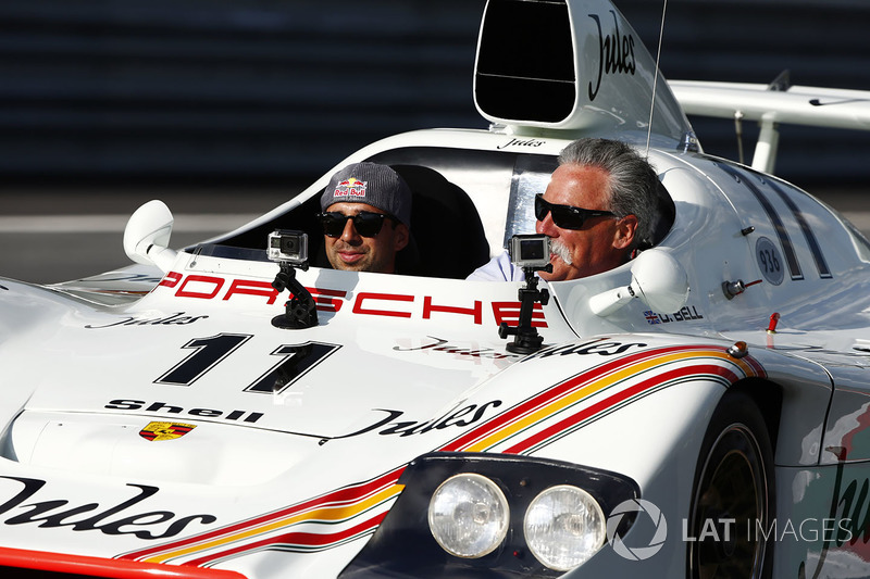 Chase Carey, Chairman, Formula One, rides in a Porsche 936 racer driven by Neel Jani