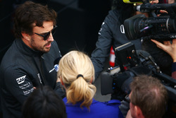 Fernando Alonso, McLaren, talks to the media in the paddock