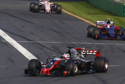 Romain Grosjean, Haas F1 Team VF-17, leads Carlos Sainz Jr., Scuderia Toro Rosso STR12, and Sergio Perez, Force India VJM10