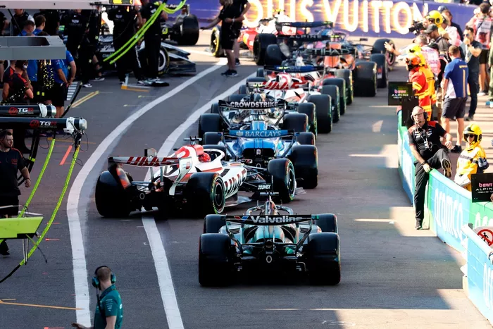 Lance Stroll, Aston Martin Racing, Esteban Ocon, Haas F1 Team