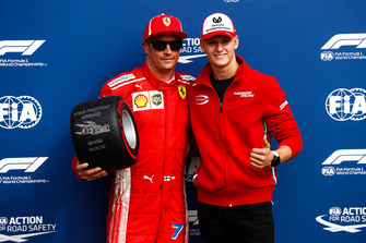 Mick Schumacher presents Kimi Raikkonen, Ferrari, with the Pirelli Pole Position award