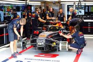 Red Bull team members work on the Daniel Ricciardo Red Bull Racing RB14