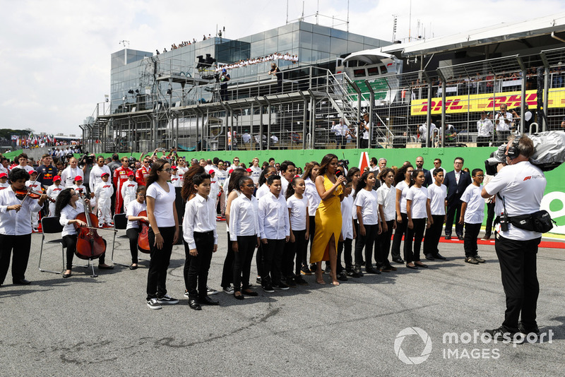 The national anthem is performed on the grid prior to the start