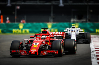 Sebastian Vettel, Ferrari SF71H, leads Charles Leclerc, Sauber C37