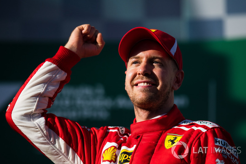 Race winner Sebastian Vettel, Ferrari celebrates on the podium