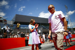 Grid Girls in national costume flank the drivers parade as Valtteri Bottas, Mercedes AMG F1, passes