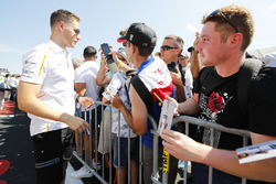 Stoffel Vandoorne, McLaren, signs autographs for fans