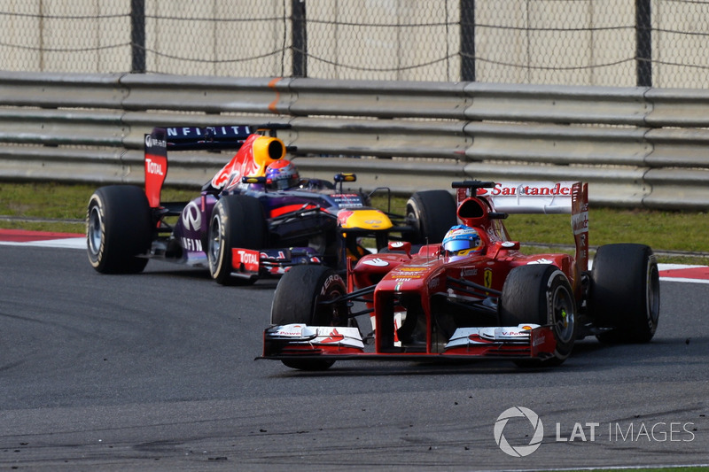 Fernando Alonso, Ferrari F138 y Sebastian Vettel, Red Bull Racing RB9