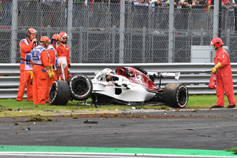 Marshals and the crashed car of Marcus Ericsson, Alfa Romeo Sauber C37 in FP2
