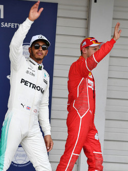 Lewis Hamilton, Mercedes AMG F1 and Sebastian Vettel, Ferrari celebrate in parc ferme