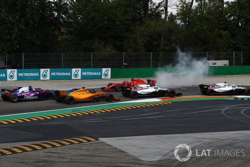 Sebastian Vettel, Ferrari SF71H facing the wrong way after making contact with Lewis Hamilton, Mercedes AMG F1 W09 while Lance Stroll, Williams FW41, Sergey Sirotkin, Williams FW41, Fernando Alonso, McLaren MCL33 and Pierre Gasly, Scuderia Toro Rosso STR13  