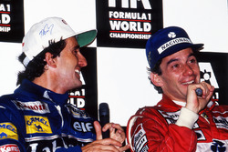 World Champion Alain Prost, Williams, and race winner Ayrton Senna, McLaren, during the post race pr