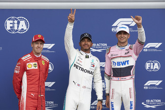 Top three Qualifiers Sebastian Vettel, Ferrari, pole man Lewis Hamilton, Mercedes AMG F1, and Esteban Ocon, Racing Point Force India