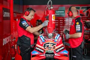 Two Ducati Team Mechanics refuels the bike