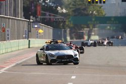 The Safety Car leads Lewis Hamilton, Mercedes AMG F1 W08, the rest of the field