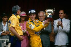 Podium: race winner Ayrton Senna, Team Lotus with Lotus boss Peter Warr, who collected the constructors trophy