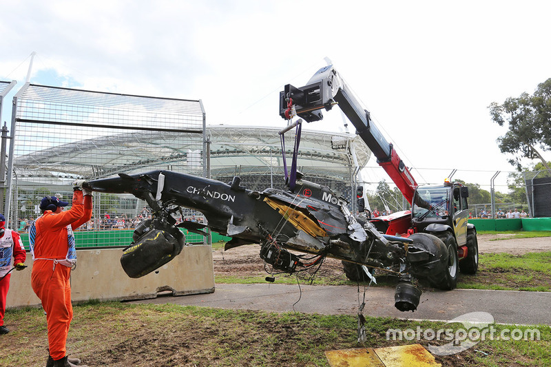 The McLaren MP4-31 of Fernando Alonso, McLaren is removed from the gravel trap after his race stopping crash