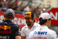 Fernando Alonso, McLaren, talks to Max Verstappen, Red Bull Racing and Sergio Perez, Force India