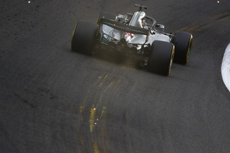 Sparks fly from the rear of Lewis Hamilton, Mercedes AMG F1 W09