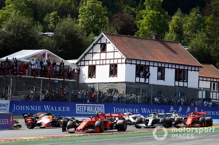 Charles Leclerc, Ferrari SF90, leads Sebastian Vettel, Ferrari SF90, Lewis Hamilton, Mercedes AMG F1 W10 and Valtteri Bottas, Mercedes AMG W10. Kimi Raikkonen, Alfa Romeo Racing C38 has just been tipped into the air by Max Verstappen, Red Bull Racing RB15
