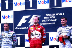 Podium: Race winner Rubens Barrichello, Ferrari F1 2000, second place Mika Hakkinen, Mclaren MP4-15