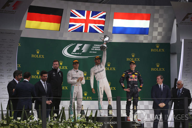 Lewis Hamilton, Mercedes AMG, celebrates victory on the podium alongside Nico Rosberg, Mercedes F1 W07 Hybrid and Max Verstappen, Red Bull Racing RB12