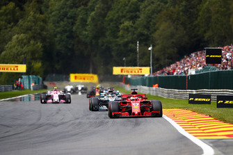 Sebastian Vettel, Ferrari SF71H, leads Lewis Hamilton, Mercedes AMG F1 W09, Sergio Perez, Racing Point Force India VJM11, and Esteban Ocon, Racing Point Force India VJM11 Sam Bloxham