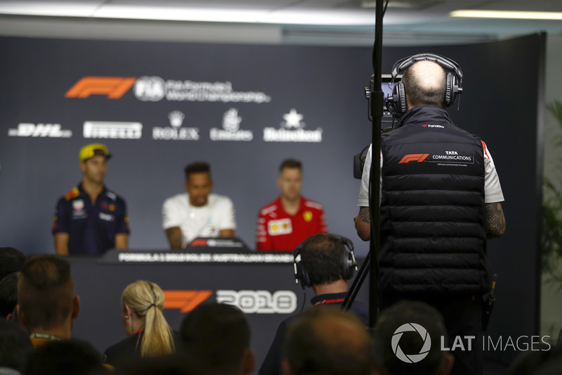 A TV Cameraman records Daniel Ricciardo, Red Bull Racing, Lewis Hamilton, Mercedes AMG F1, and Sebastian Vettel, Ferrari, in the Thursday drivers Press Conference