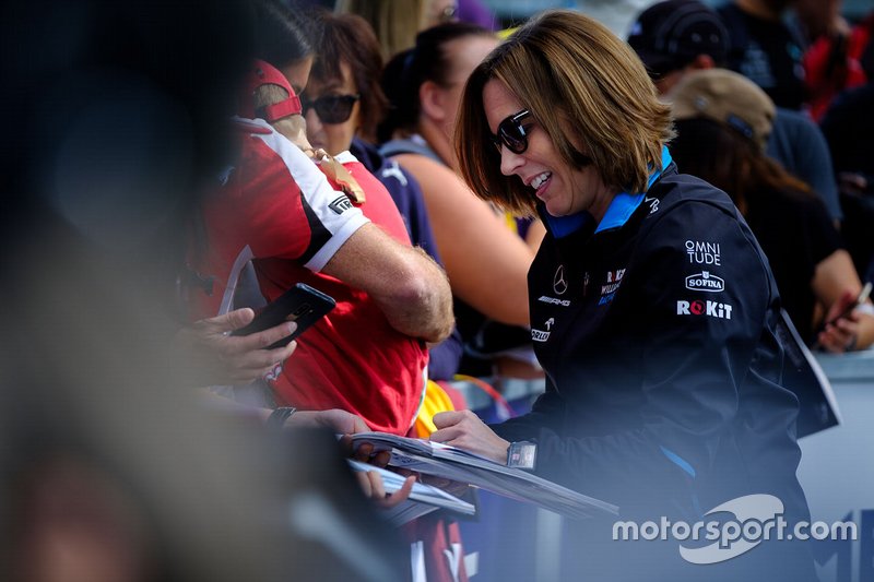 Claire Williams, Deputy Team Principal, Williams Racing signs autographs for fans