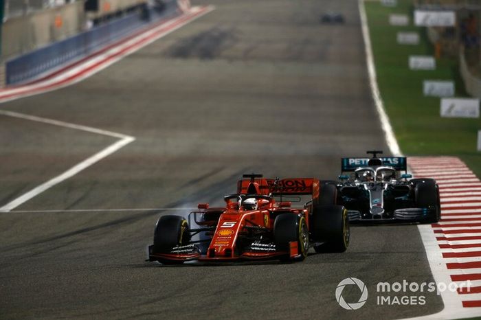 Sebastian Vettel, Ferrari SF90, leads Lewis Hamilton, Mercedes AMG F1 W10