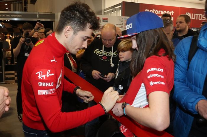 Charles Leclerc, Ferrari signs autographs for fans before opening Autosport International 2020