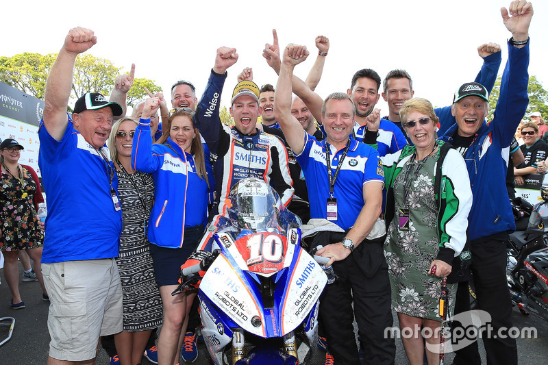 Peter Hickman celebrates with his team after winning the RL360º Superstock TT race