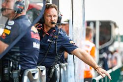 Christian Horner, Team Principal, Red Bull Racing holds hand out looking for rain