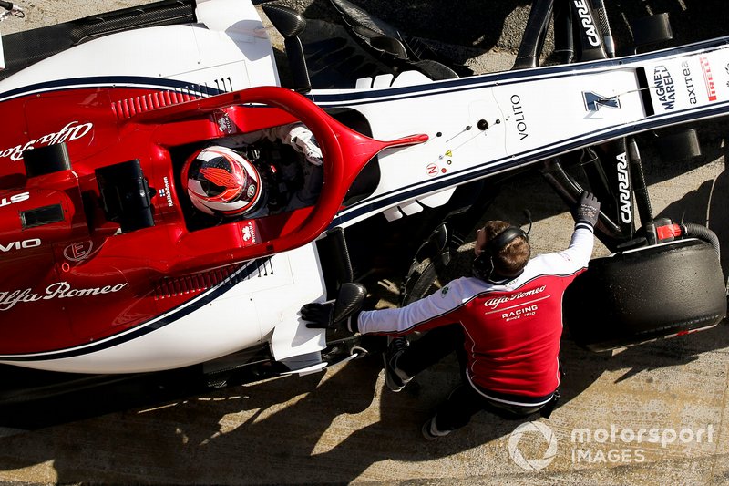 Kimi Raikkonen, Alfa Romeo Racing, stops in his pit area