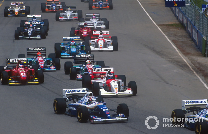 Nigel Mansell follows Damon Hill, Williams FW16B with Mika Hakkinen, McLaren MP4/9, Gerhard Berger, Ferrari 412T1B, Rubens Barrichello, Eddie Irvine, Jordan 194 and Johnny Herbert, Benetton B194, and Martin Brundle, McLaren MP4/9