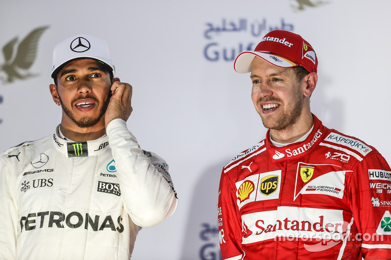 Lewis Hamilton, Mercedes AMG, second place, Sebastian Vettel, Ferrari, race winner, on the podium