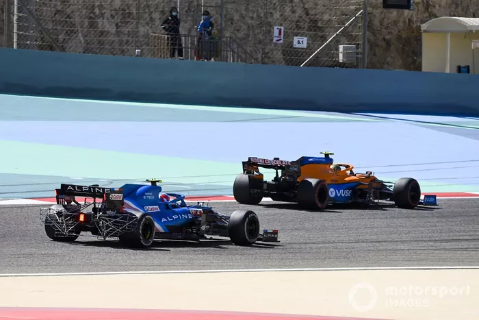 Esteban Ocon, Alpine A521 and Lando Norris, McLaren MCL35M 