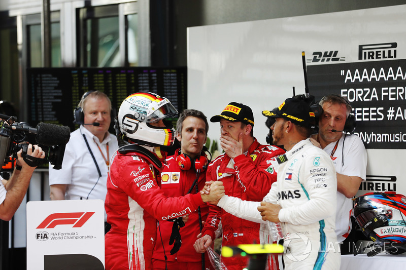 Winner Sebastian Vettel, Ferrari, is congratuled by second place Lewis Hamilton, Mercedes AMG F1, th