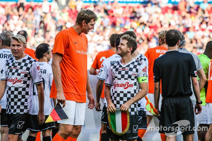 Dirk Nowitzki, jugador de la NBA y Sebastian Vettel, Ferrari