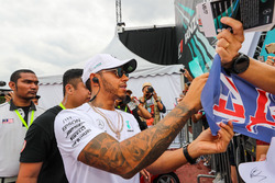 Lewis Hamilton, Mercedes AMG F1 signs autographs for the fans