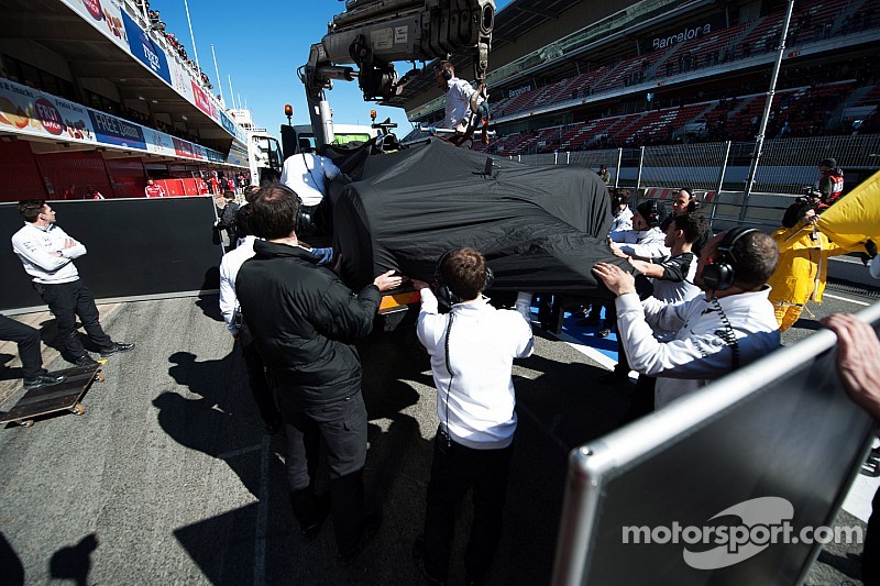 The McLaren MP4-30 of Fernando Alonso, McLaren is recovered back to the pits on the back of a truck