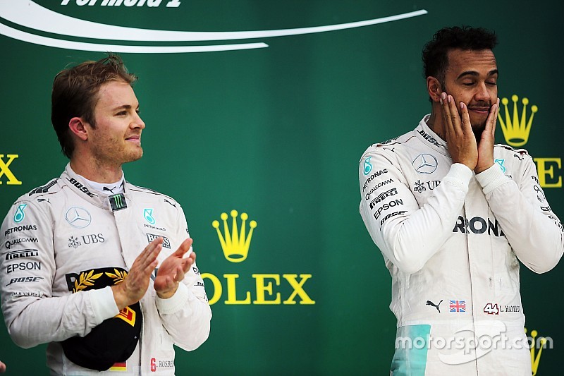 The podium (L to R): second placed Nico Rosberg, Mercedes AMG F1 with team mate and race winner Lewi